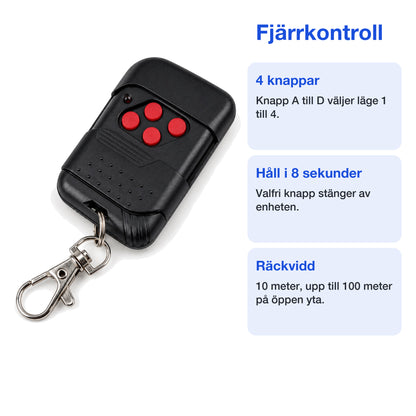 Svart fjärrkontroll med nyckelring till viltskrämman på vit bakgrund
