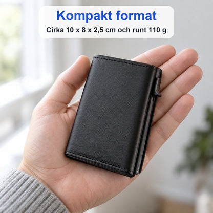 Svart slät pop-up-plånbok i en öppen hand som visar det kompakta formatet cirka 10 x 8 x 2,5 cm