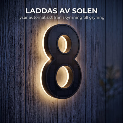 Husnummer som laddas av solen och lyser på natten
